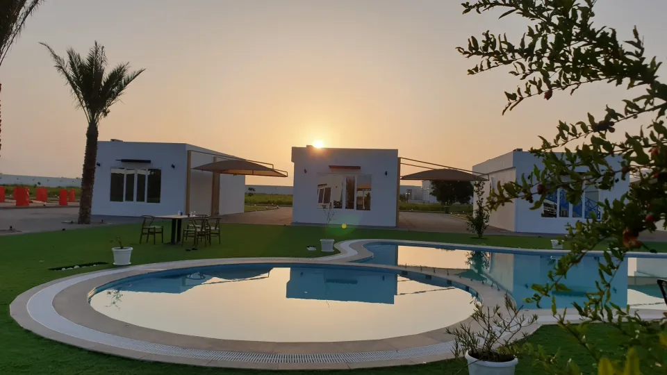 The sun setting over a villa