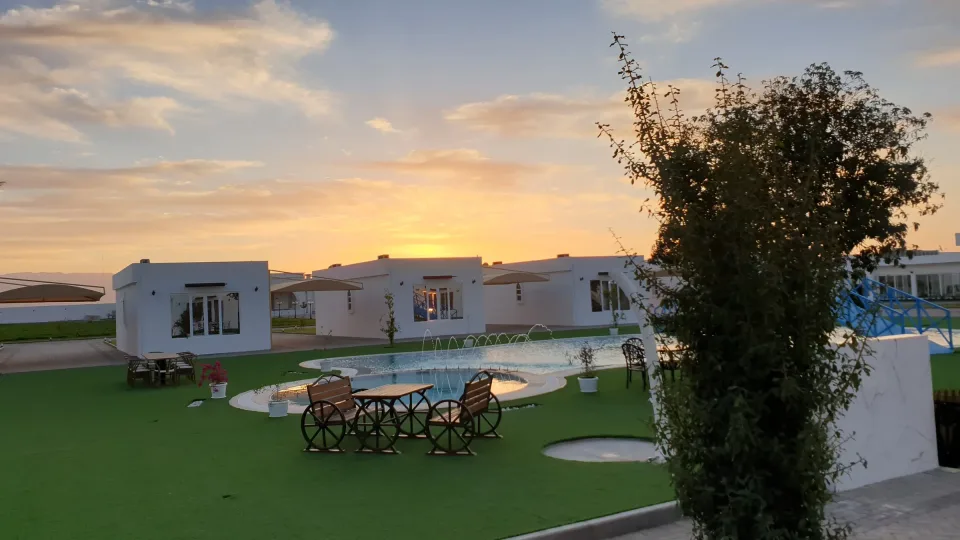 The pool lawn at sunset