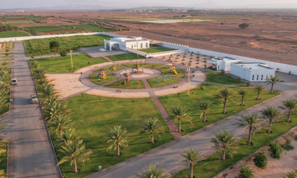 Gardens, palms and play area