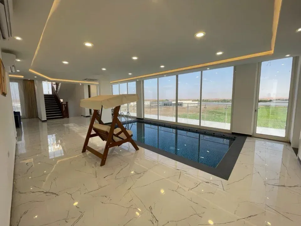 Salalah Villa · Pool hall with swing seat